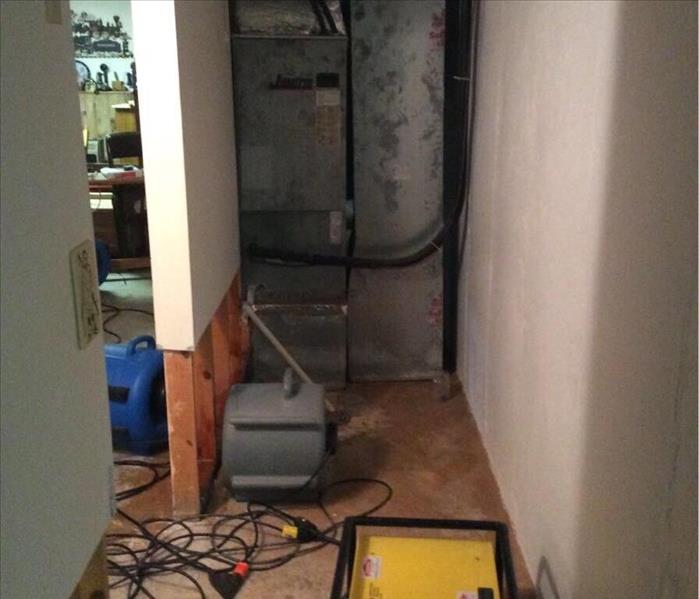 A mechanical closet after raw sewage has been cleaned up and water restoration has been done.